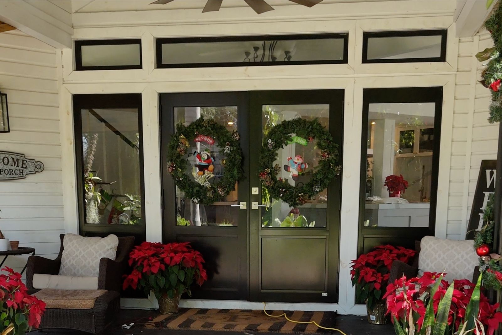 Black impact French doors with sidelites and transom after installation in South Florida