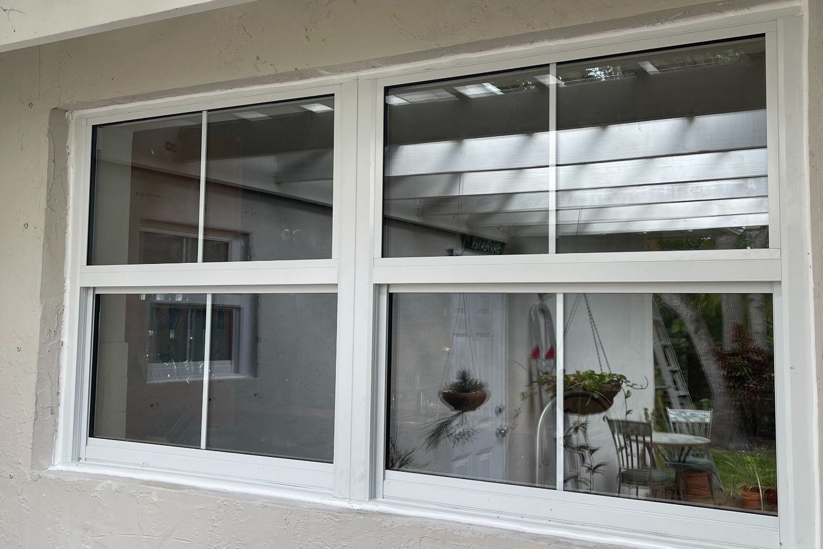 White impact windows in a mulled opening after installation in South Florida
