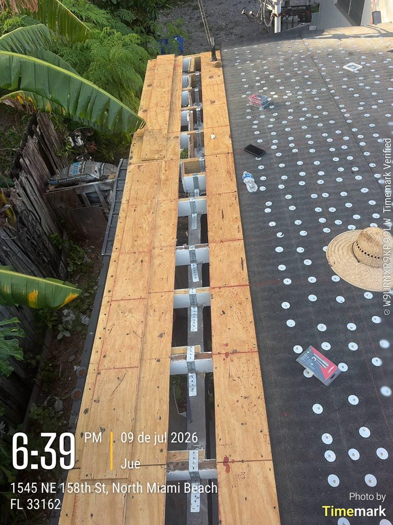 Roof-to-wall hurricane strap reinforcement