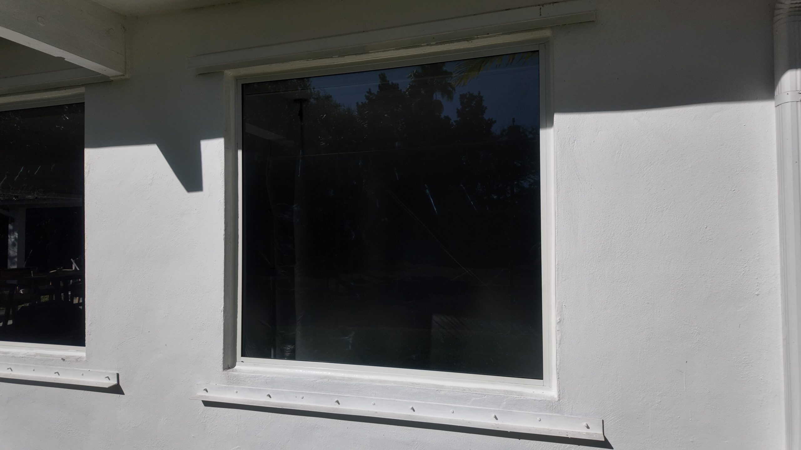 Completed impact window installation in Miami by Bigfoot Windows & Roofing — after