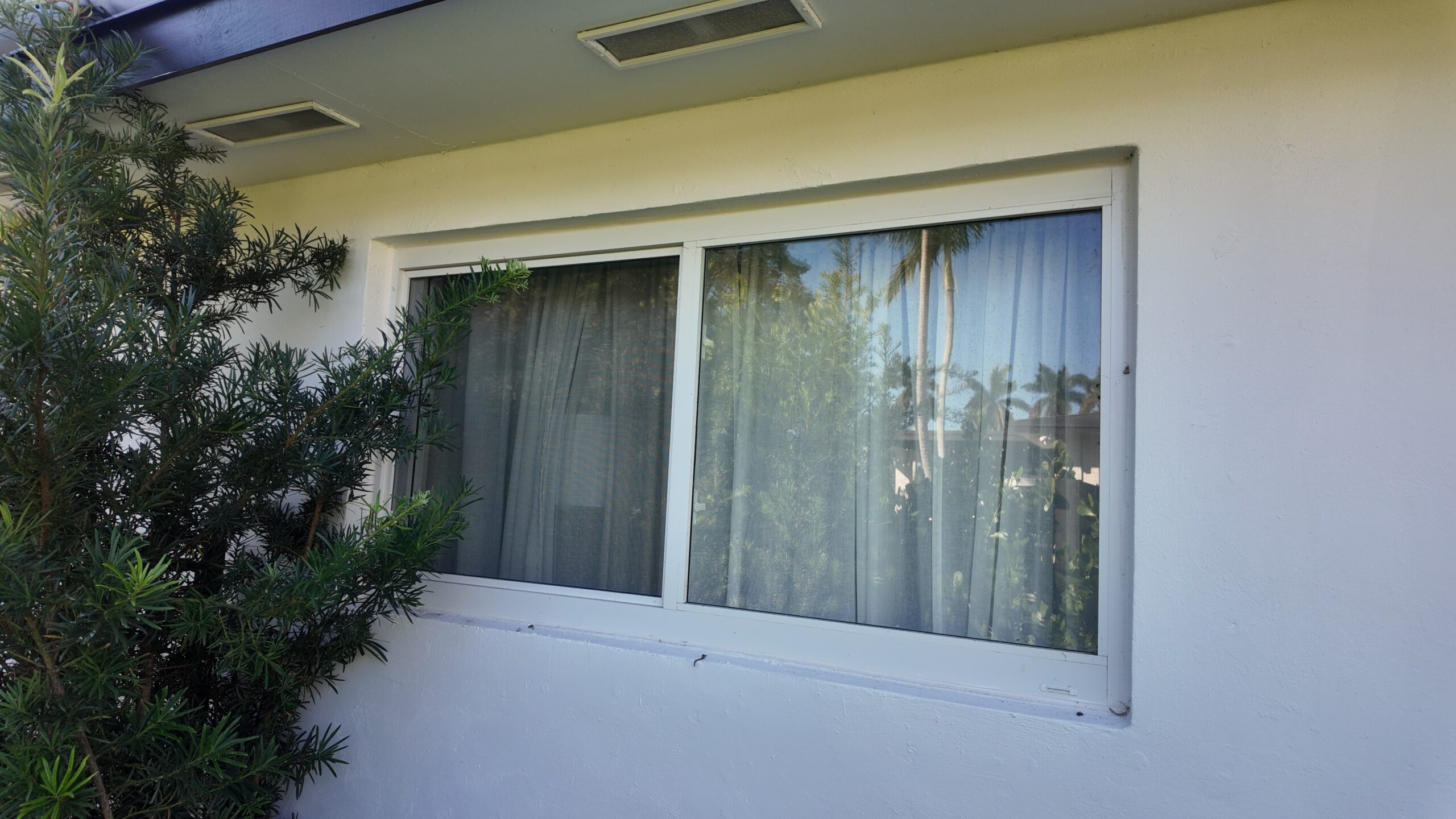 Completed impact window installation in Palmetto Bay by Bigfoot Windows & Roofing — after