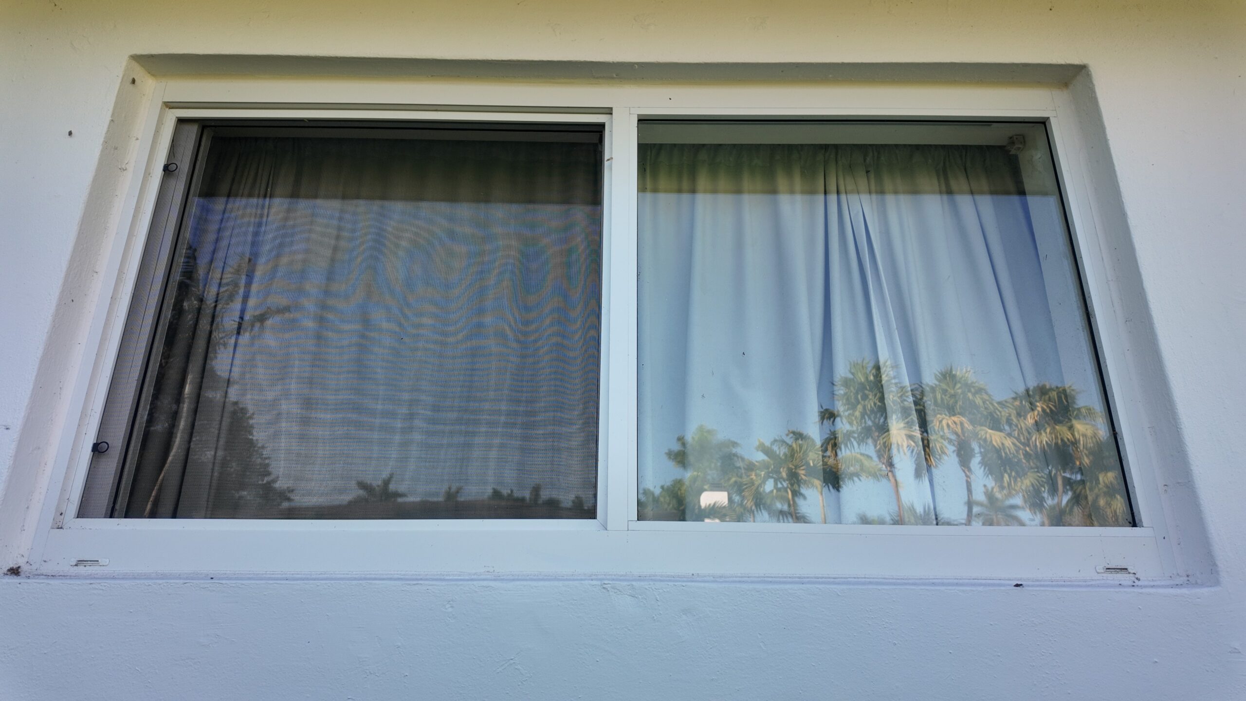 Completed impact window installation in Palmetto Bay by Bigfoot Windows & Roofing — after
