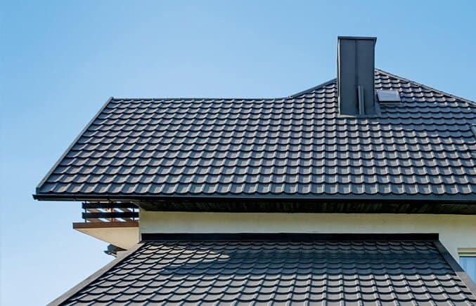 Tile-inspired metal roofing profile