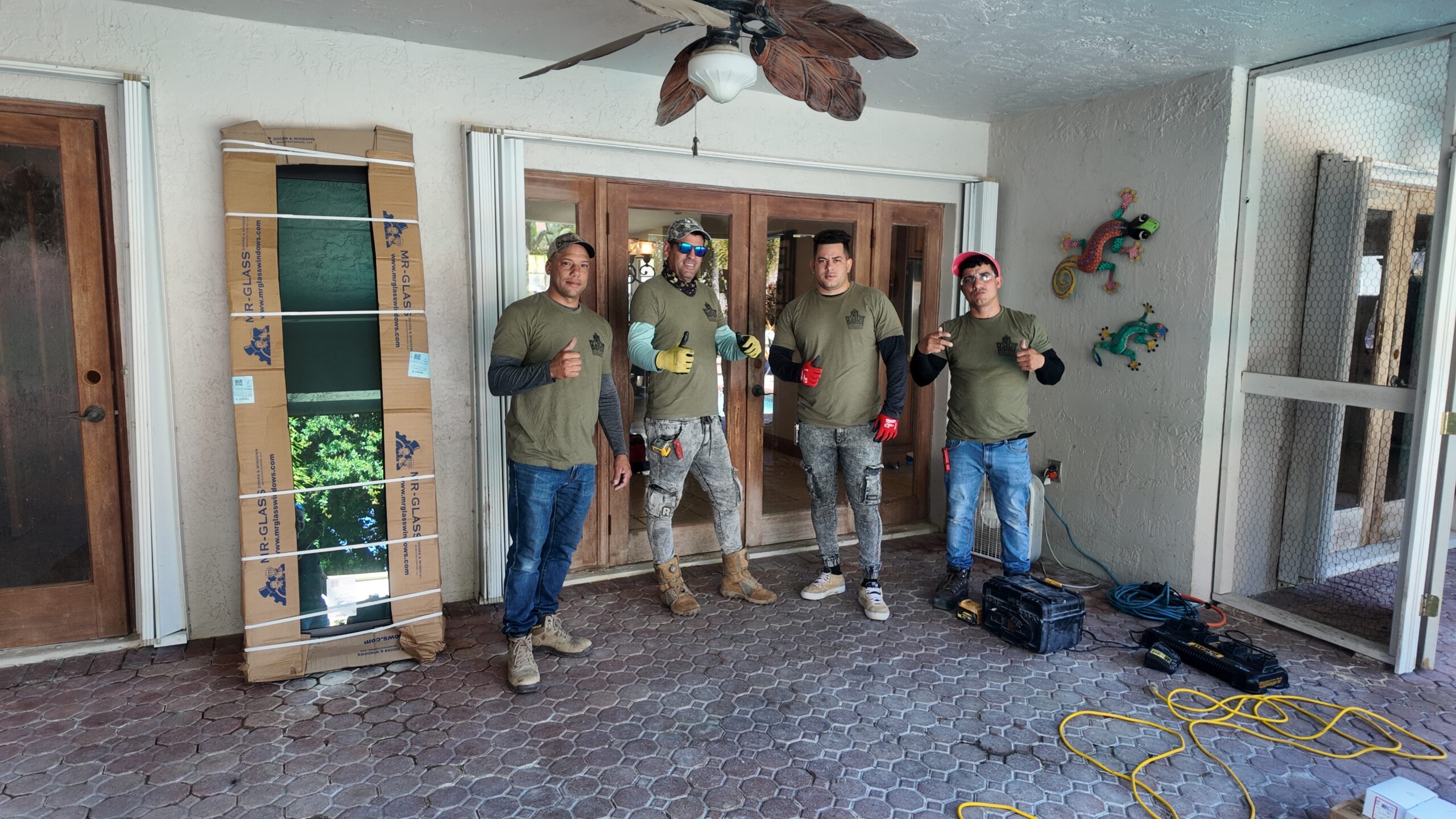 The installation team view 1 of the window and door replacement project