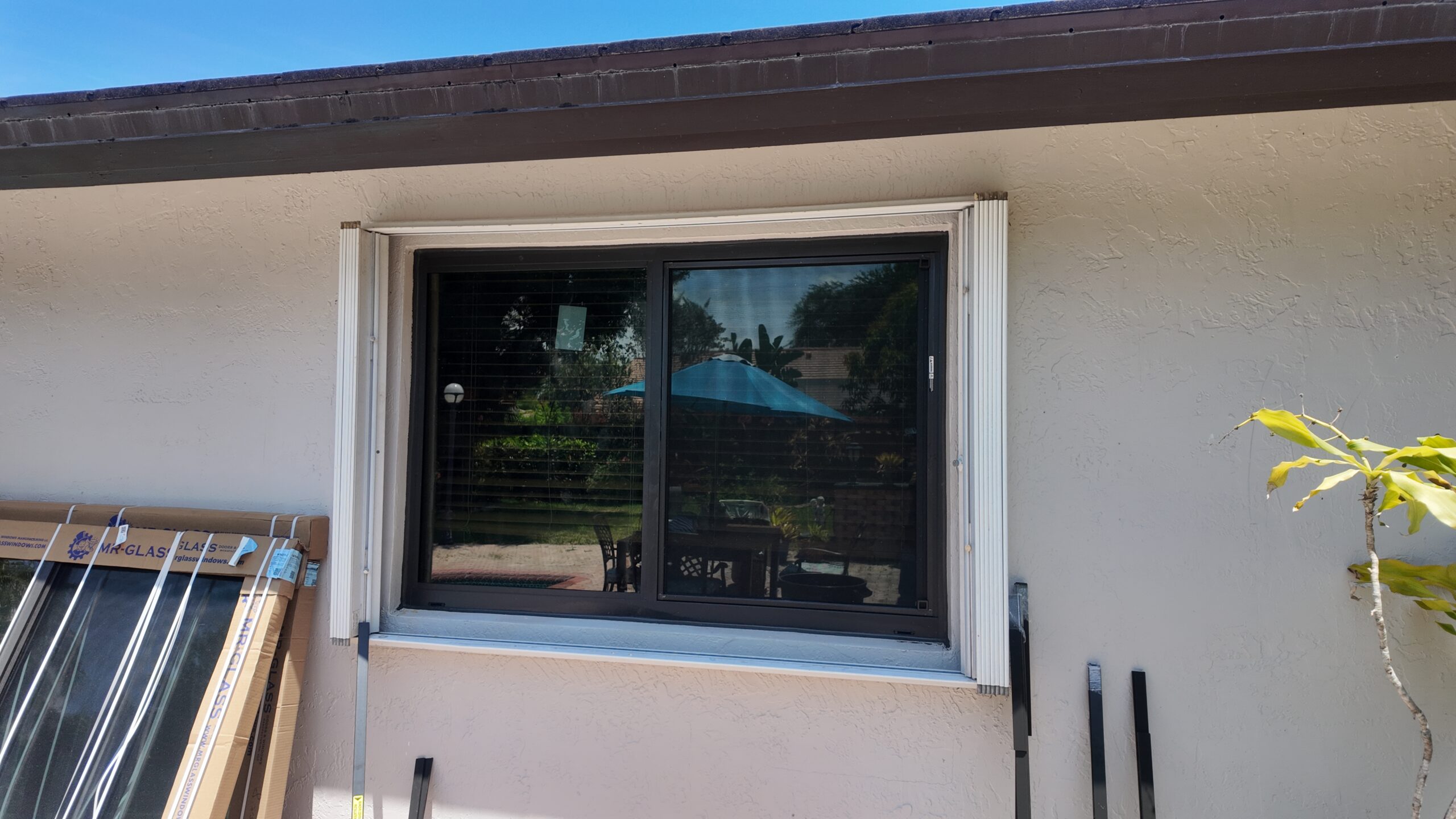 New dark-framed window after installation