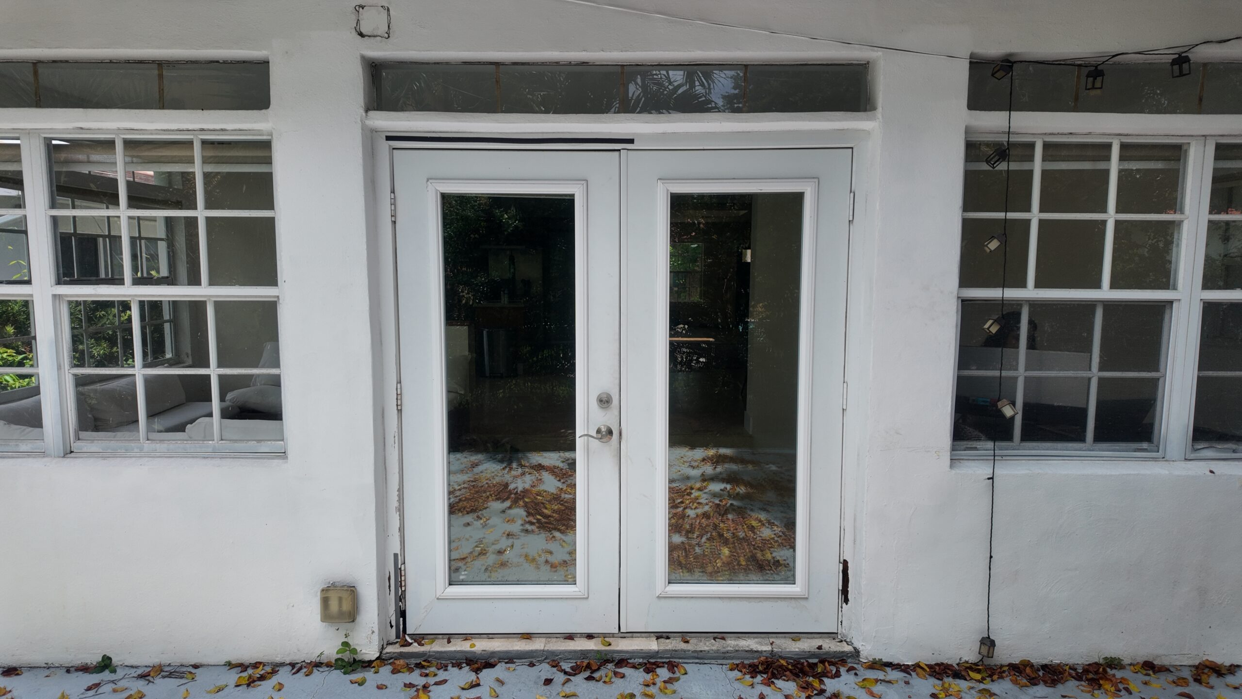 Additional property view showing light-framed openings and a glazed door