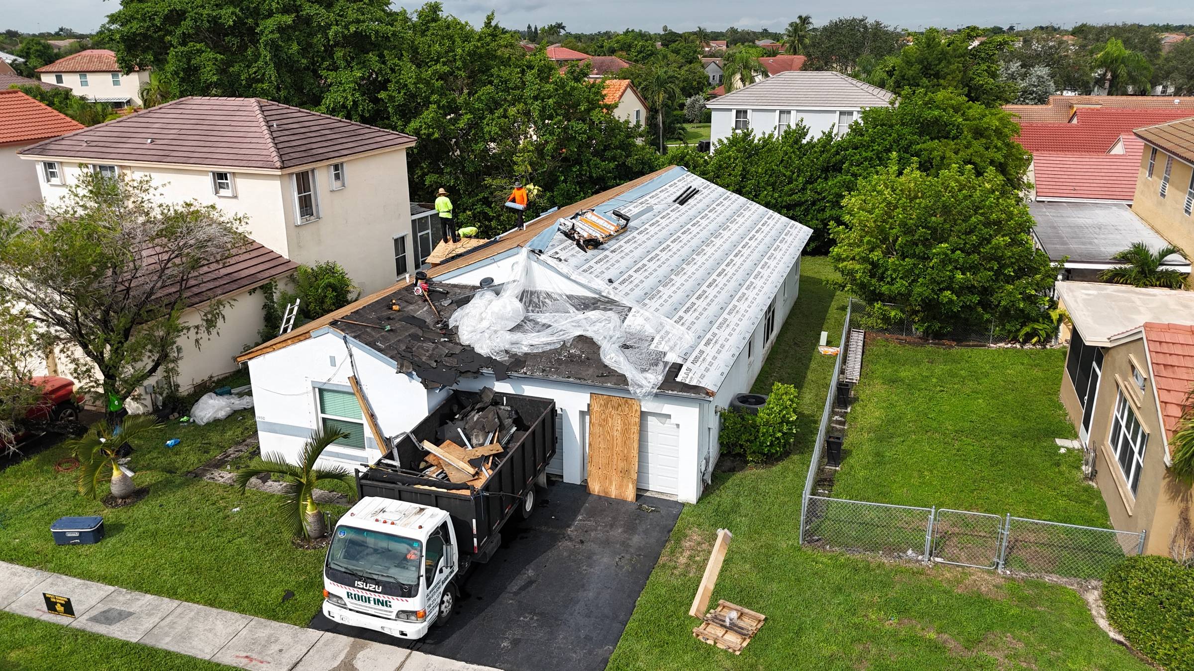Storm-damaged roof in Pembroke Pines by Bigfoot Windows & Roofing