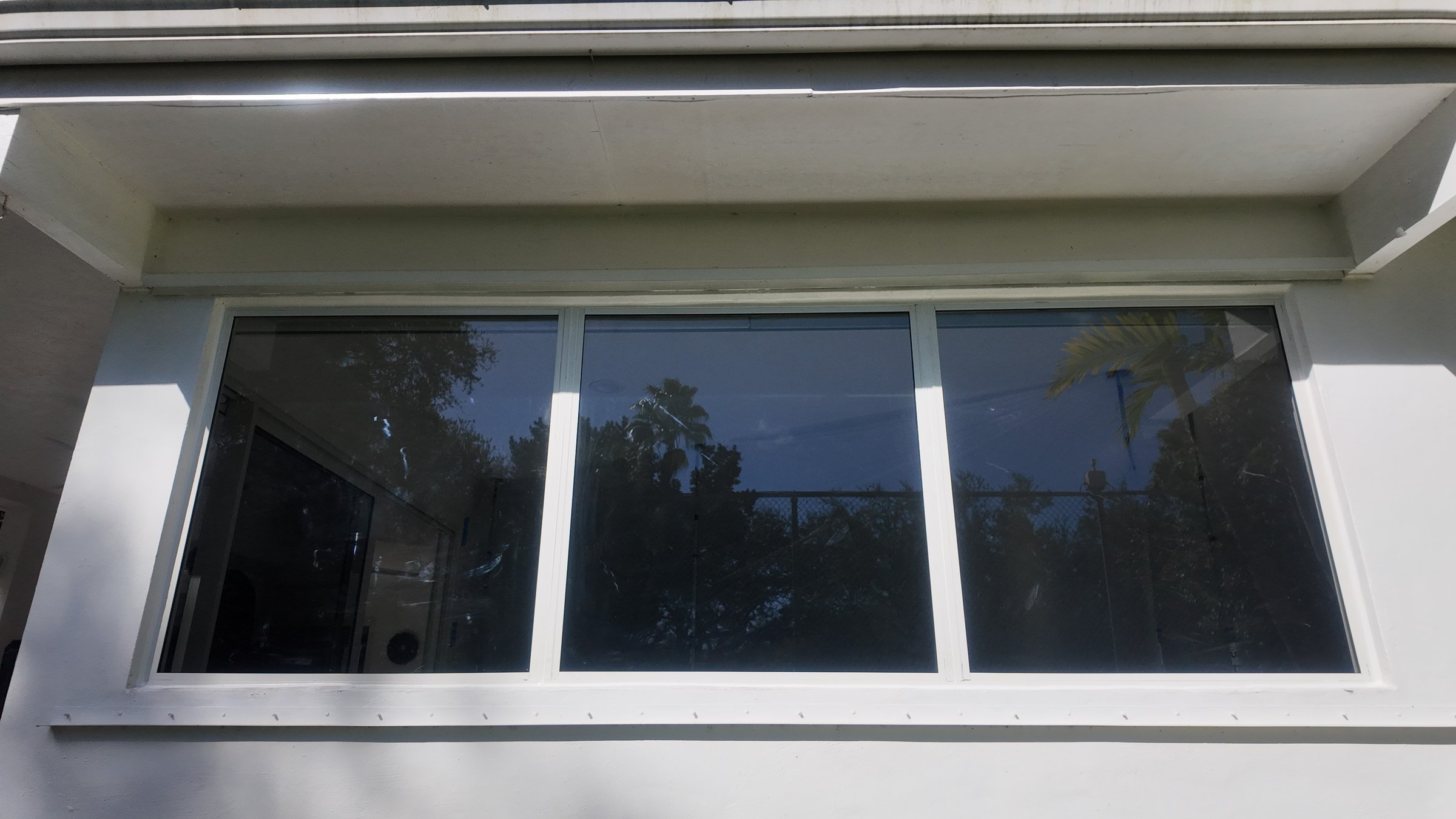 Completed impact window installation in Miami by Bigfoot Windows & Roofing — view 2