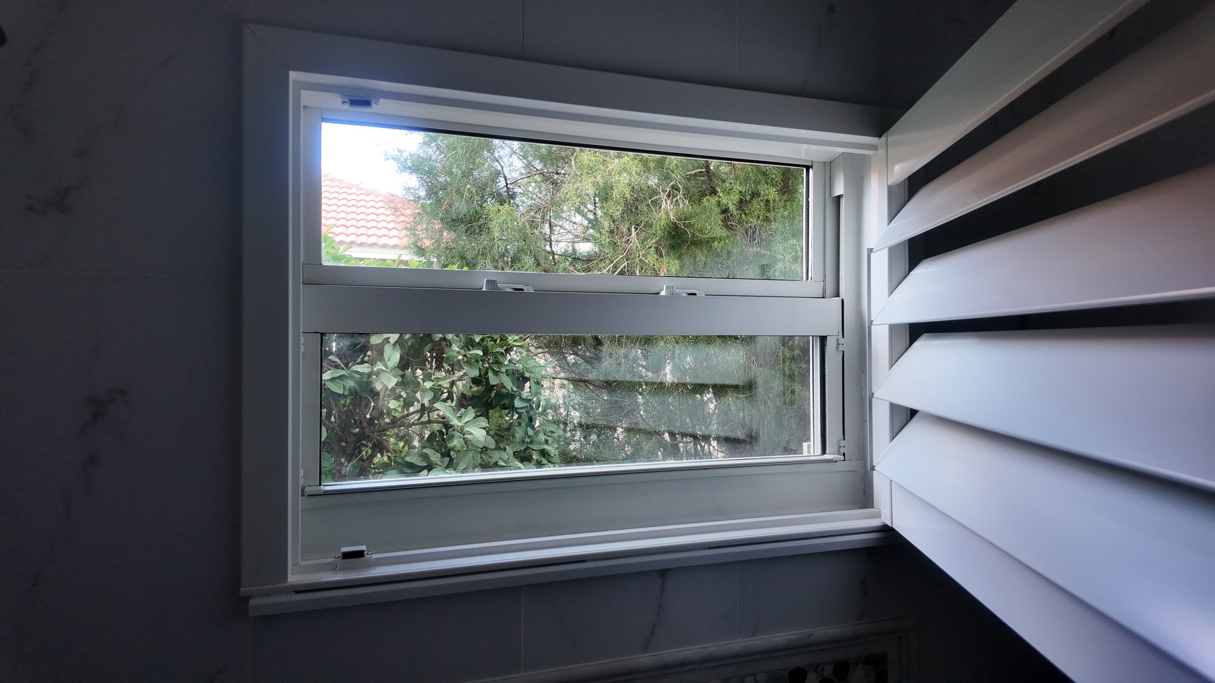 Completed impact window installation in Tampa by Bigfoot Windows & Roofing — after