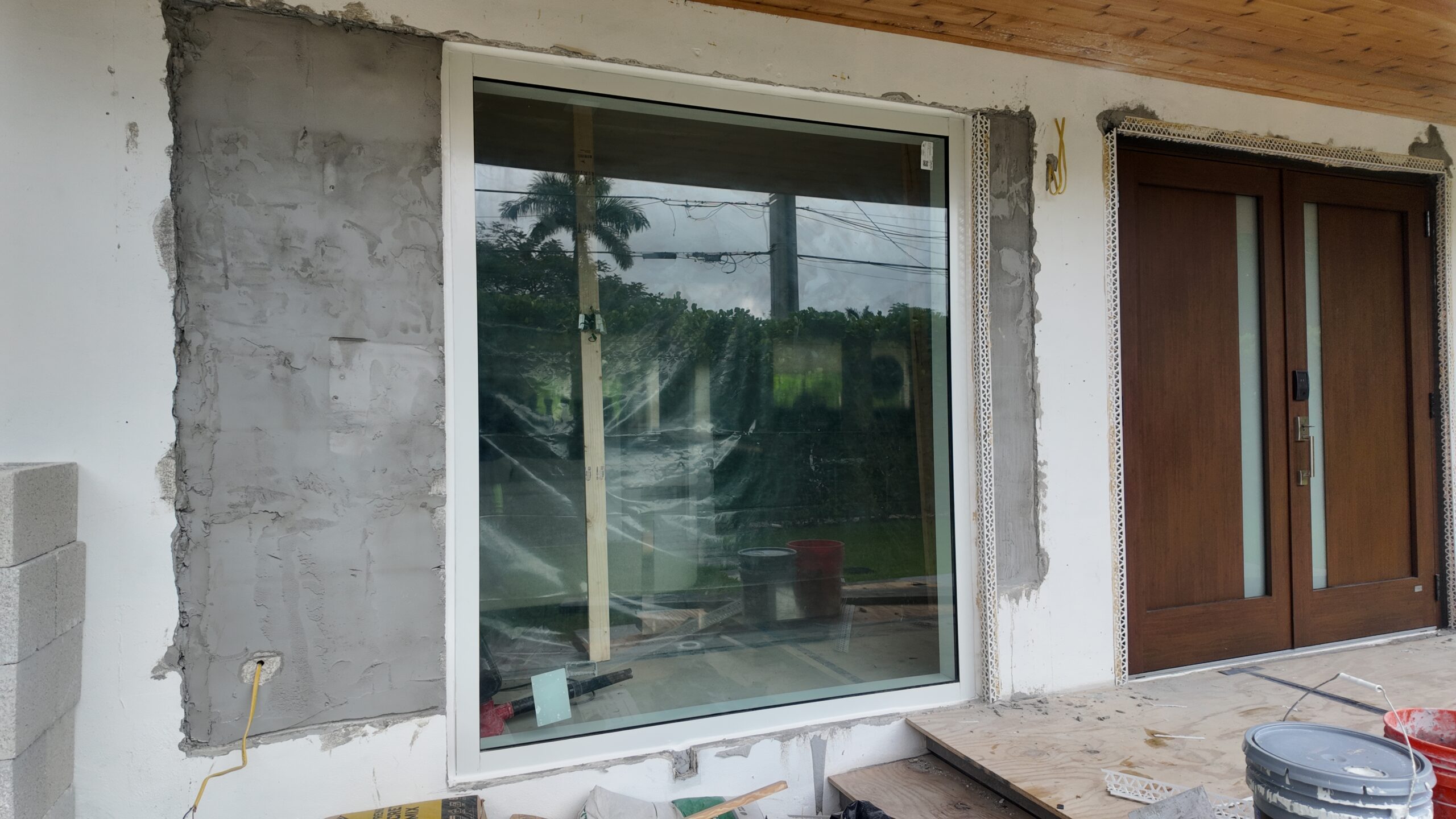 In-progress entry door and storefront installation in Miami