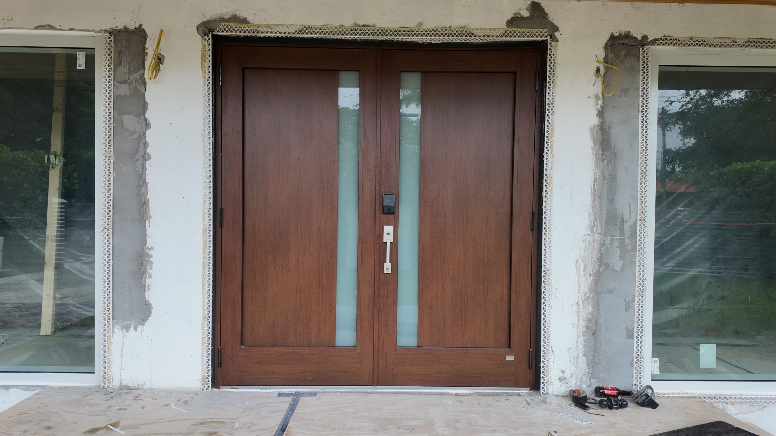 In-progress entry door and storefront installation in Miami