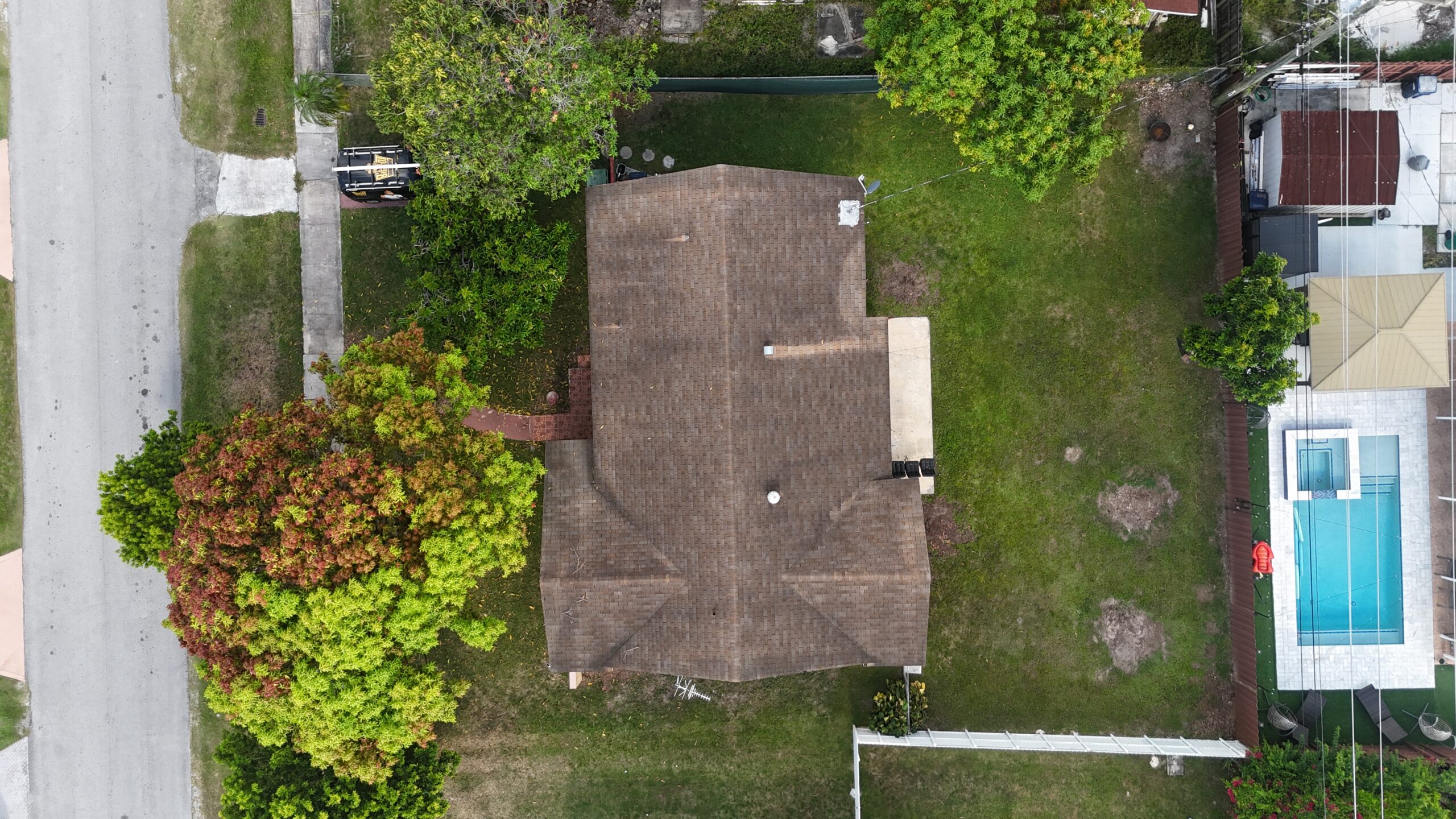 Before aerial view 3 of the shingle roofing project in Cutler Bay, Florida